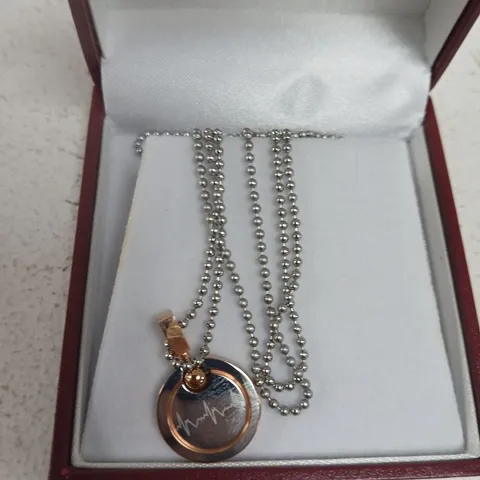 ROSE GOLD-TONE CIRCULAR PENDANT NECKLACE WITH  ENAMEL HEARTBEAT MOTIF