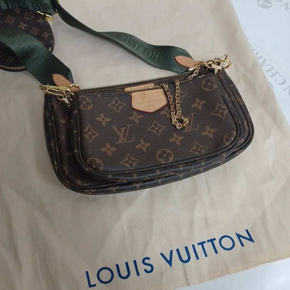 louis Vuitton hand bag in brown with green strap 