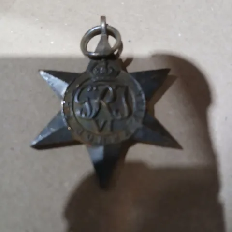 APPROXIMATELY 80 METAL PENDANT WITH GR MONOGRAM ENGRAVED THE BURMA STAR