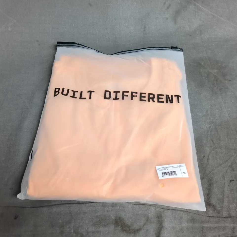 BUILT DIFFERENT CREW NECK T-SHIRT IN LIGHT ORANGE – XL