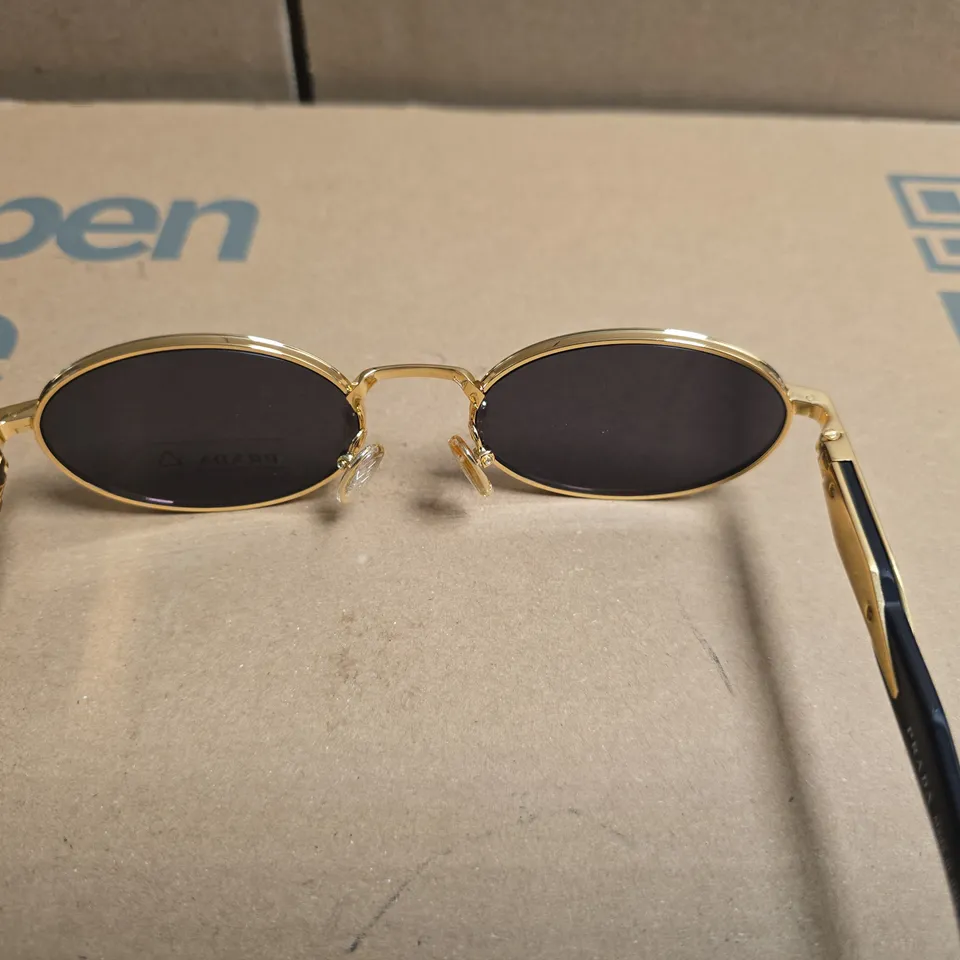 PRADA MILANO GOLD TONE OVAL SUNGLASSES WITH BLACK LENSES