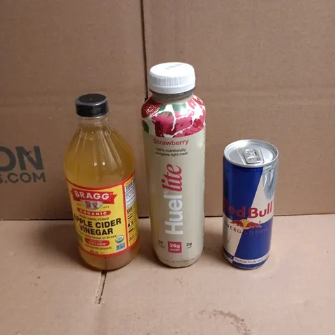 APPROXIMATELY 12 ASSORTED FOOD AND DRINKS ITEMS TO INCLUDE - RED BULL, HUEL LITE STRAWBERRY SHAKE, BRAGGS APPLE CIDER VINEGAR ETC 