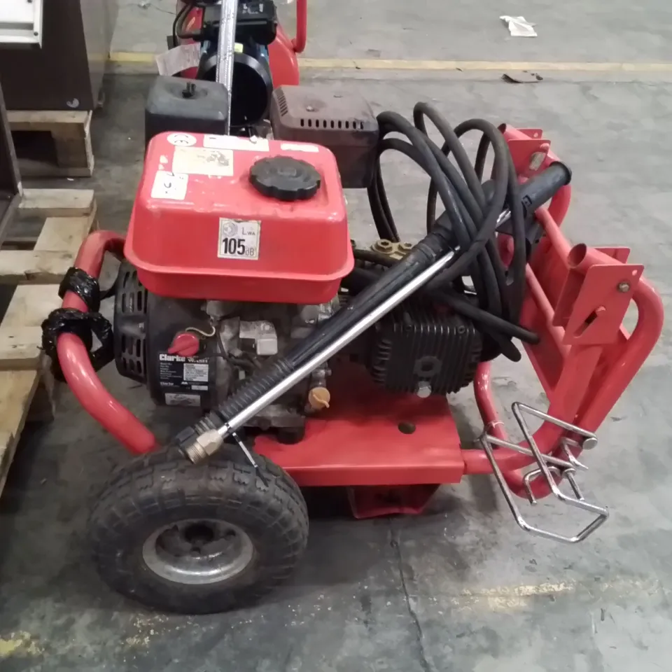 PORTABLE PETROL-POWERED HIGH-PRESSURE WASHER ON RED FRAME (VERIFY MODEL)