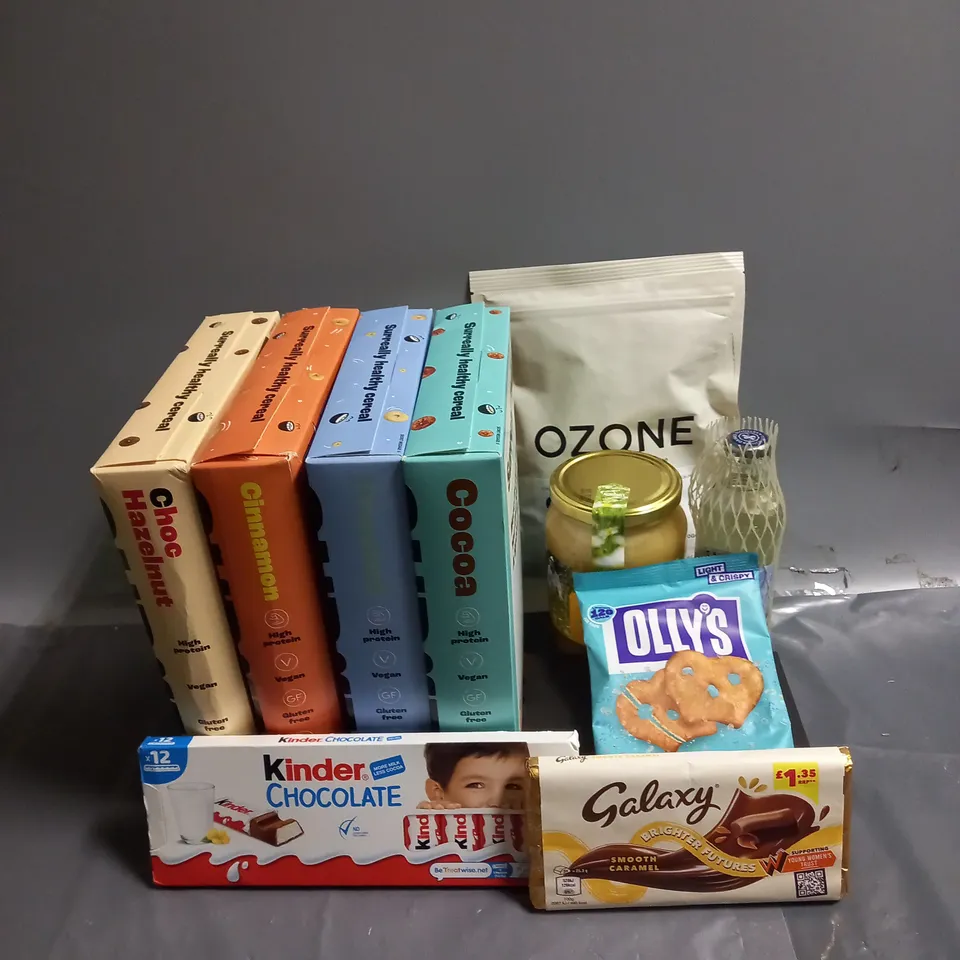 APPROXIMATELY 10 ASSORTED FOOD/DRINK PRODUCTS TO INCLUDE - SURREAL PROTEIN CEREAL - NORDMEL WILD RAWHONEY - WHITAKERS CHOCOLATES - ETC
