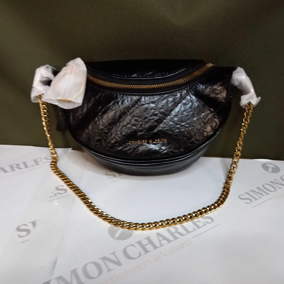 CHARLES & KEITH FAUX LEATHER HAND BACK IN BLACK