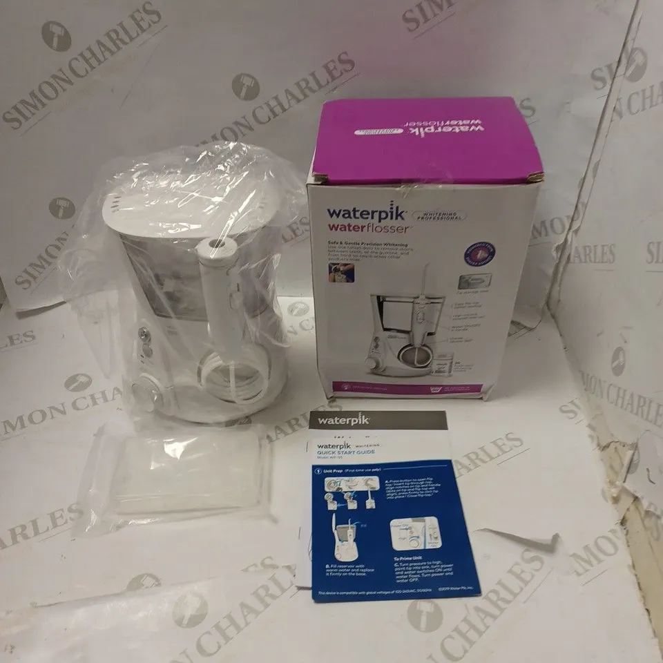 BOXED WATERPIK PROFESSIONAL WHITENING WATER FLOSSER, WITH ACCESSORIES AND INSTRUCTIONS