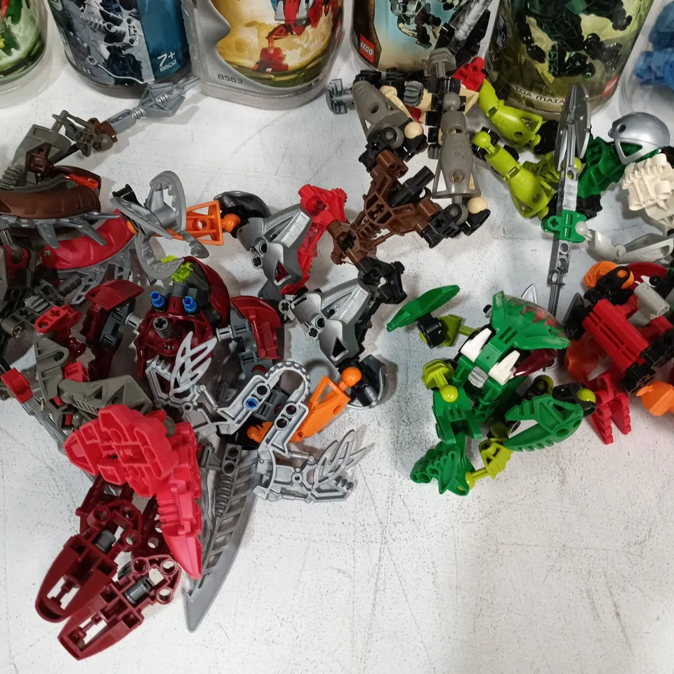 LOT OF ASSORTED  BIONICLE FIGURES AND TUBS