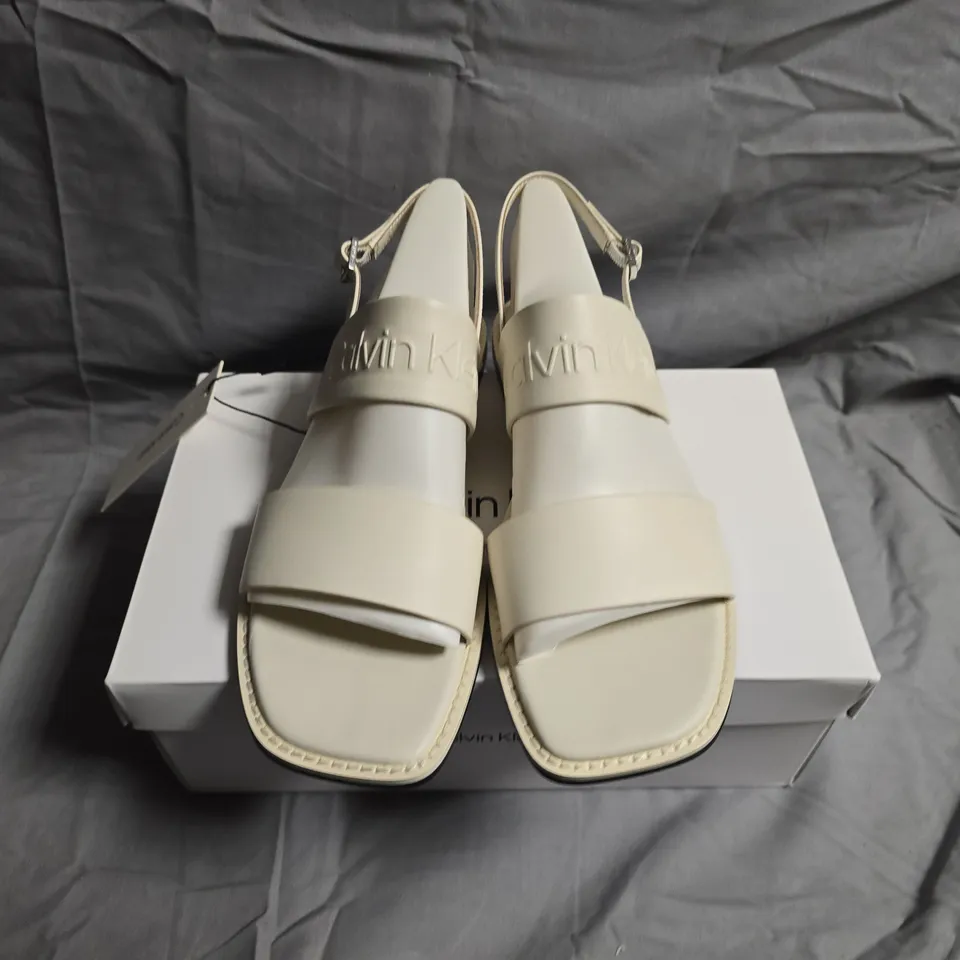 BOXED PAIR OF CALVIN KLEIN FLAT SANDALS - UK SIZE 38