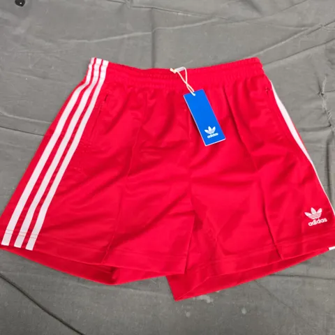 ADIDAS RED SHORTS WITH WHITE STRIPES – TAG ATTACHED (UK SMALL)