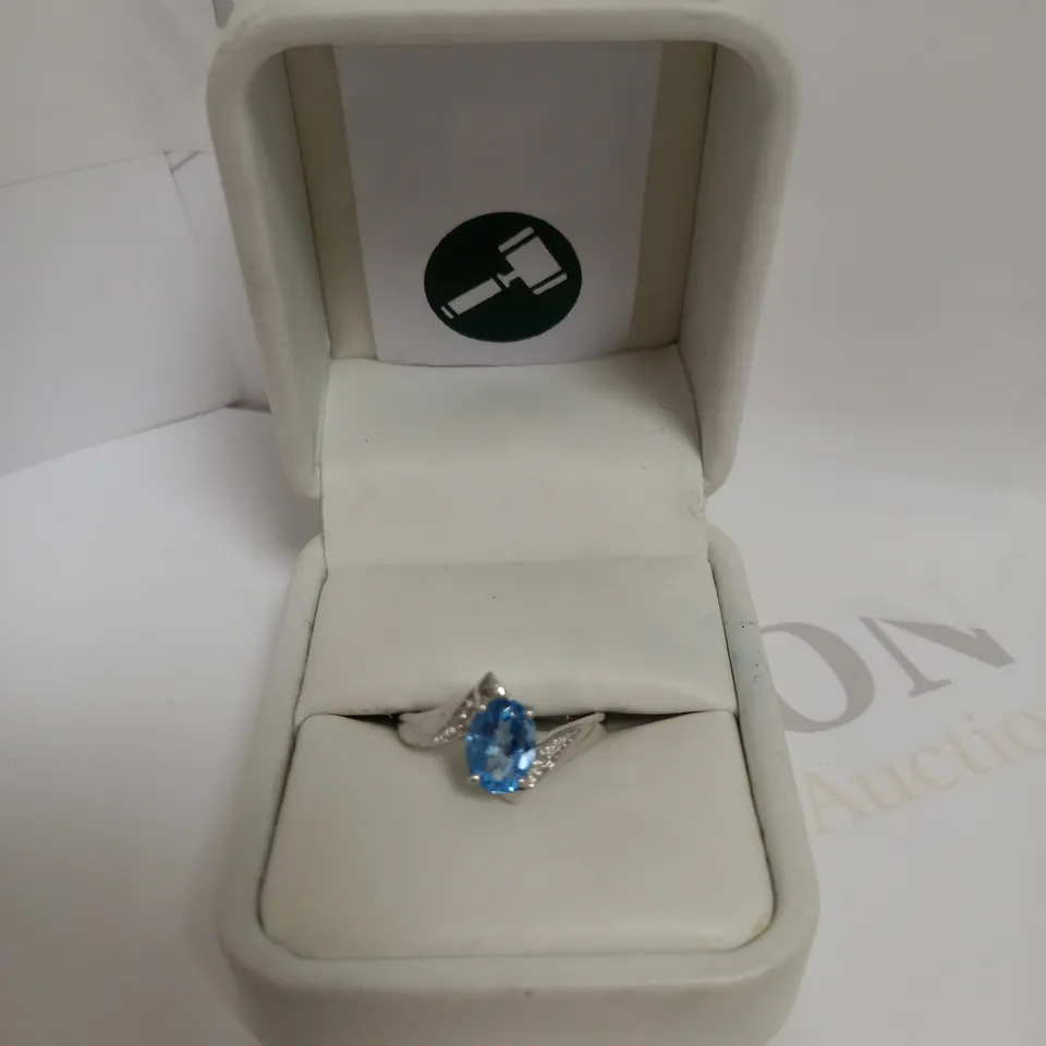 DESIGNER 9CT WHITE GOLD BLUE TOPAZ AND DIAMOND DRESS RING, +-1.35CT