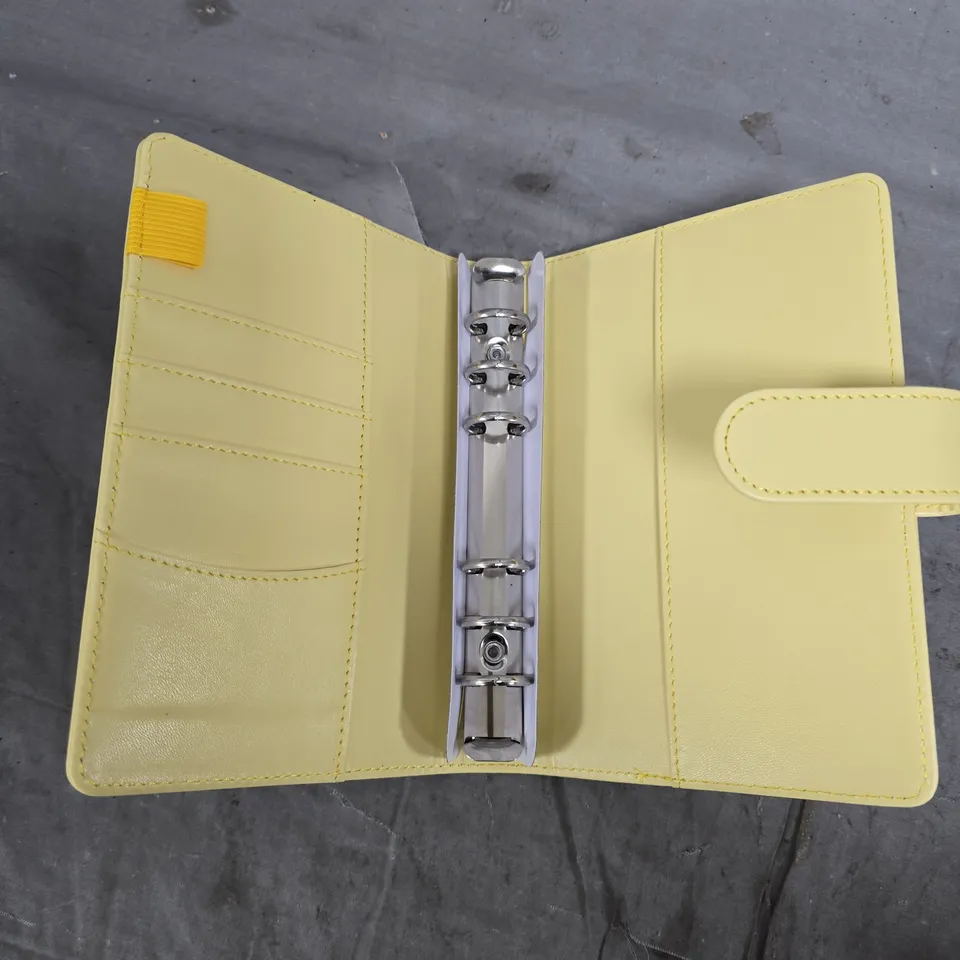 APPROXIMATELY 10 A5 BINDERS IN VARIOUS DESIGNS 