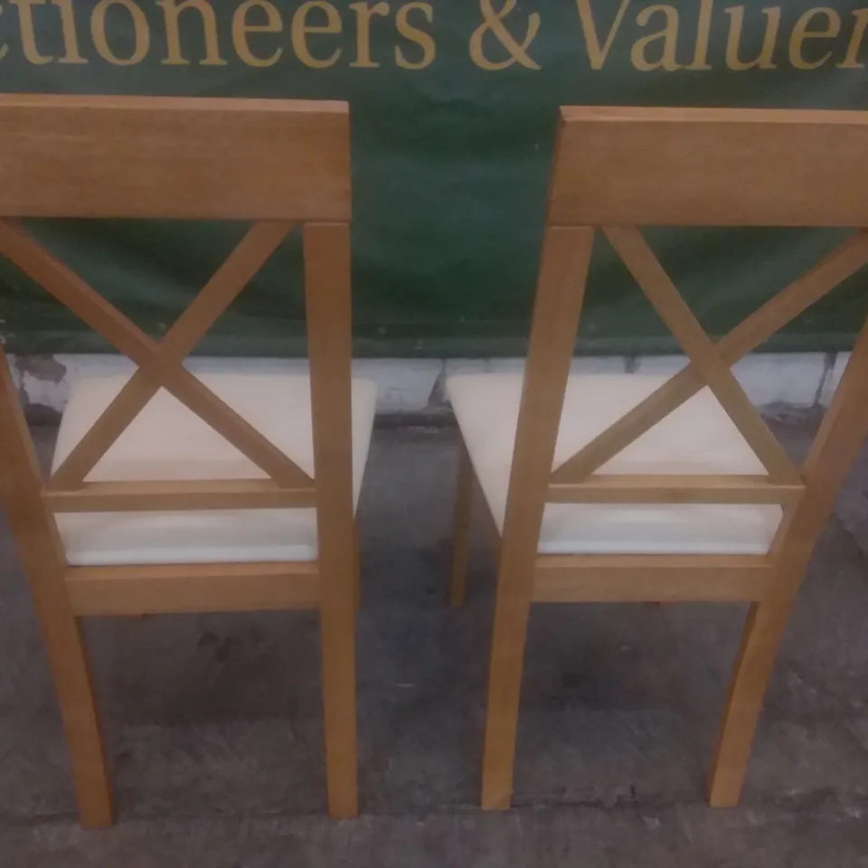 SET OF 2 DESIGNER DINING CHAIRS (IVORY LEATHER SEAT PAD)