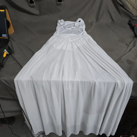 WHITE SLEEVELESS DRESS ON FABRIC-DRAPED DISPLAY