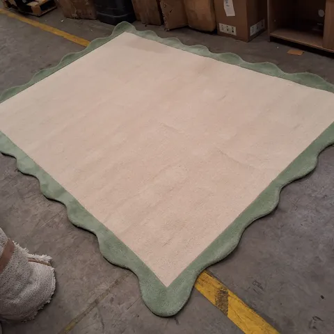 BEIGE RUG WITH GREEN SCALLOPED BORDER APPROXIMATELY 200×290CM