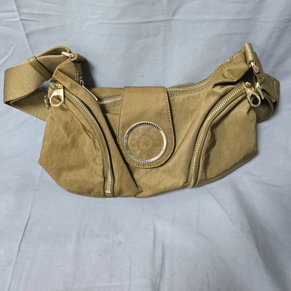 KIPLING TAN NYLON BAG WITH CIRCULAR METAL BADGE