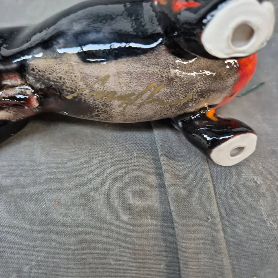 CERAMIC DOG FIGURINE, GLAZED BLACK WITH ORANGE BELLY
