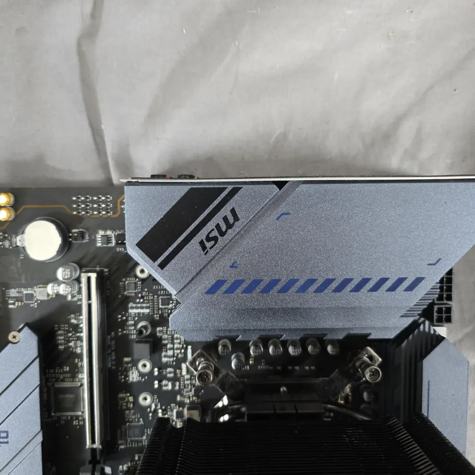 MSI TORPEDO MOTHERBOARD WITH COOLER MASTER CPU COOLER, RAM INSTALLED