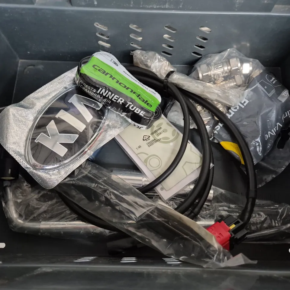 TOTE OF ASSORTED CAR ITEMS TO INCLUDE TOOLS , LOGOS AND VALVE CORES 