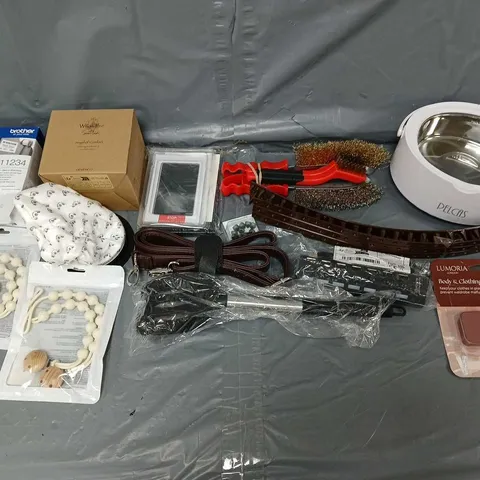 APPROXIMATELY 10 ASSORTED HOUSEHOLD ITEMS TO INCLUDE - LUMORIA BODY TAPE, ANGEL OF COMFORT CANDLE, AND BROTHER LABELS ETC.