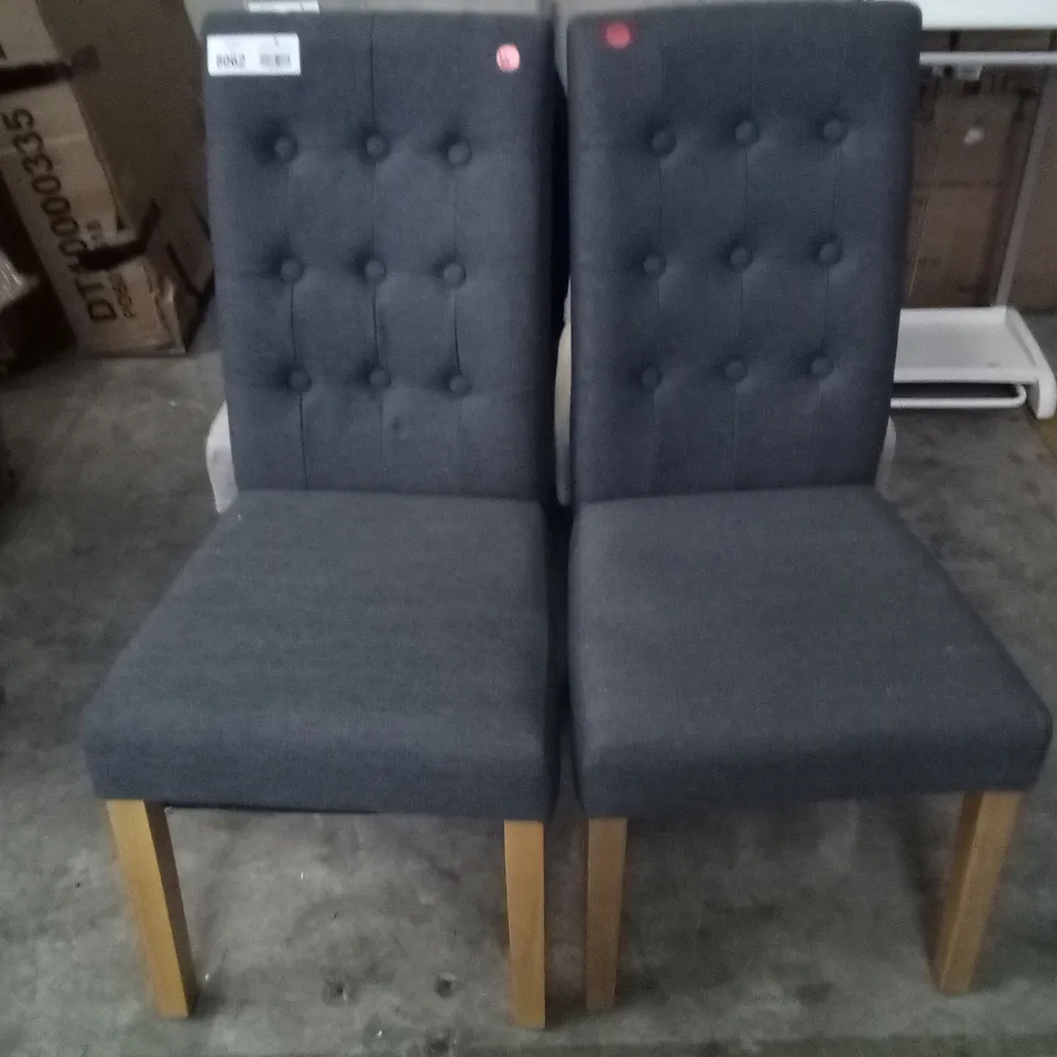 PAIR OF GREY FABRIC BUTTON BACK DINING CHAIRS WITH OAK EFFECT LEGS