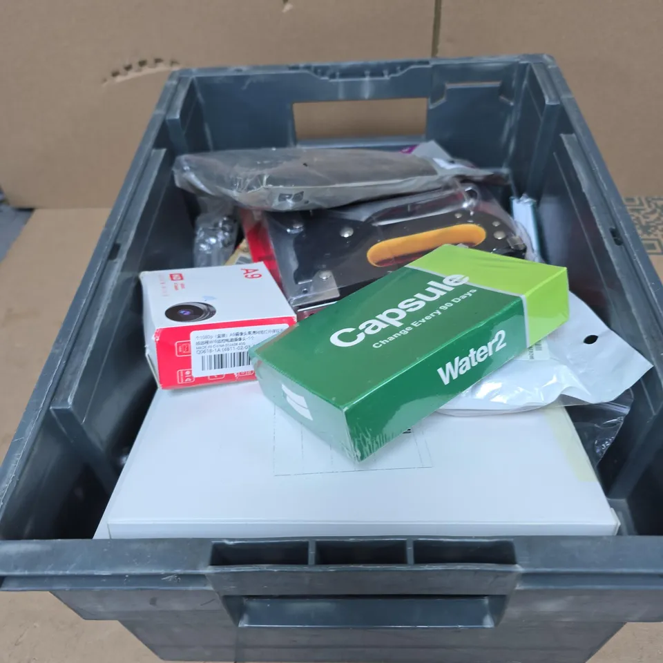 TOTE OF APPROXIMATELY 20 ASSORTED HOUSEHOLD ITEMS TO INCLUDE RED NOSE DAY "DESIGN YOUR NOSE", STAPLE GUN, CAPSULE FILTER, HD BATTERY IP CAMERA, SWITCHED SOCKET ETC