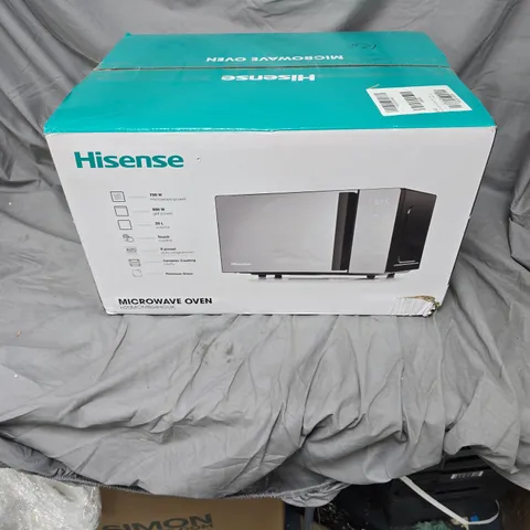 CAGE OF APPROXIMATELY 8 ASSORTED HOUSEHOLD ITEMS INCLUDING HISENSE MICROWAVE AND LEGO BOTANICALS