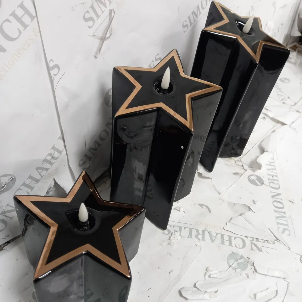 HOME REFLECTIONS CERAMIC STAR PRE-LIT CANDLES - BLACK