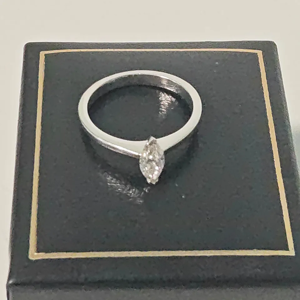 18CT WHITE GOLD SOLITAIRE RING SET WITH A MARQUISE CUT NATURAL DIAMOND