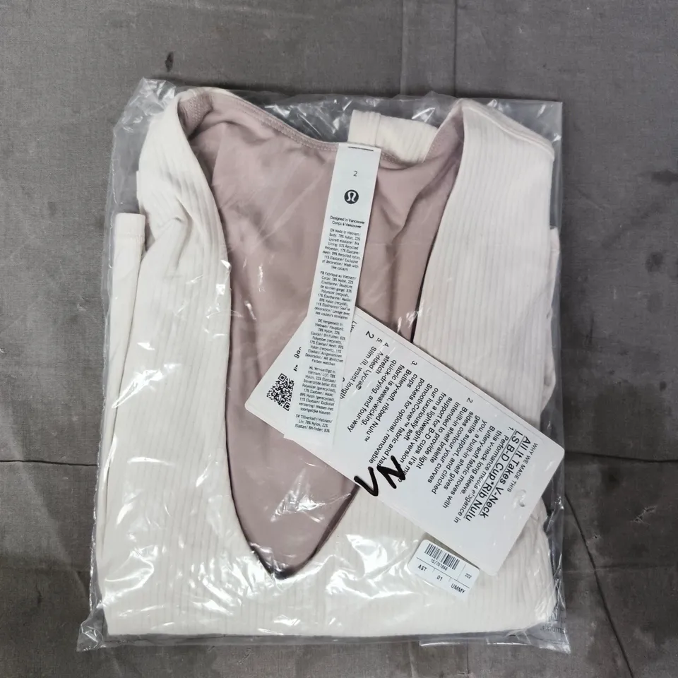 BAGGED LULULEMON ALL IT TAKES V-NECK LONG SLEEVE B-D CUP RIB NULU TOP IN CREAM SIZE 2