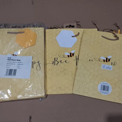 LOT OF APPROXIMATELY 100 BEE HAPPY THEMED MEDIUM GIFT BAGS IN YELLOW