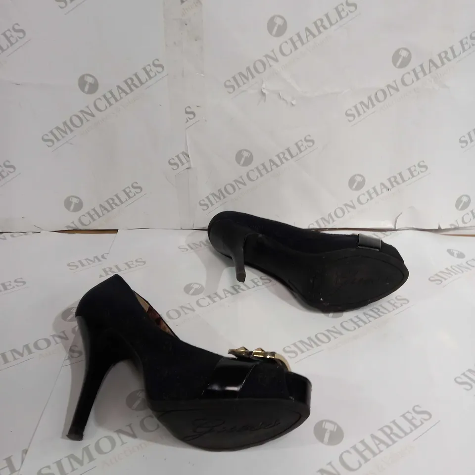 UNBOXED PAIR OF GUESS BLACK HEELS WITH GOLD BUCKLE 9 1/2