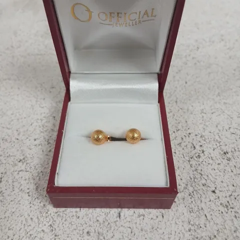 Gold-tone ball stud earrings in burgundy presentation box