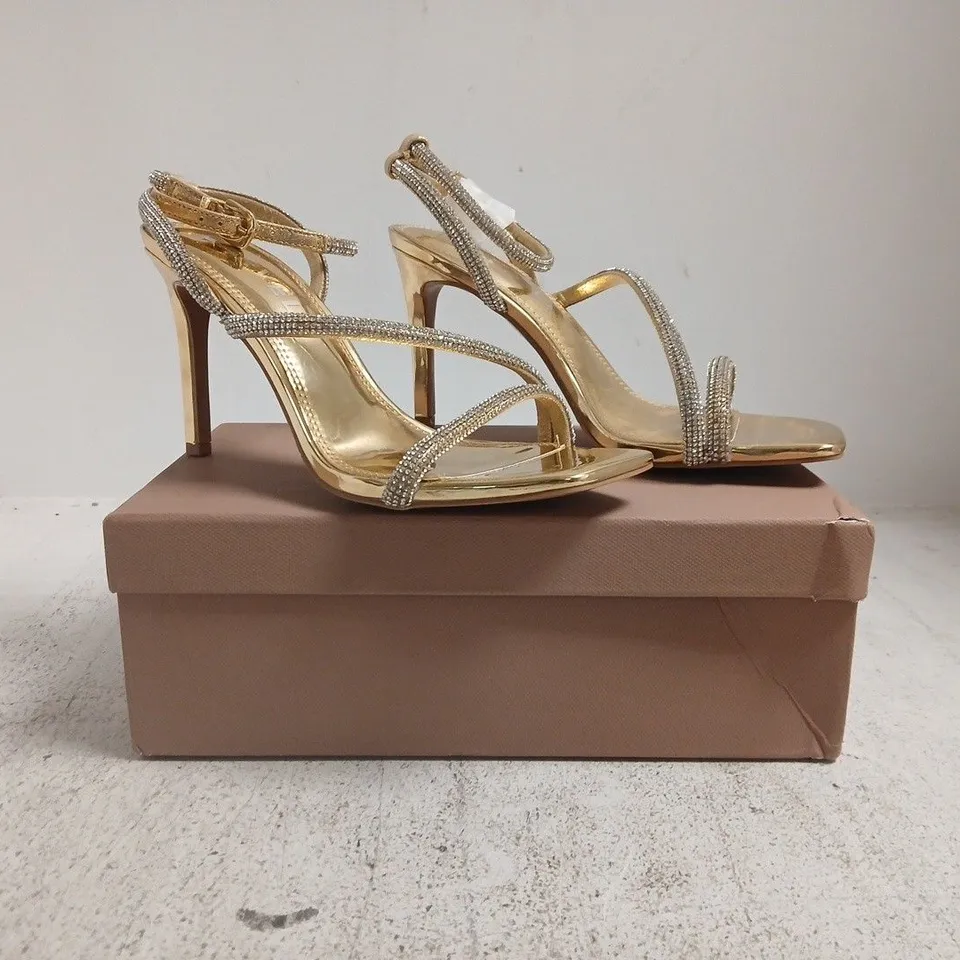 BOXED PAIR OF CARVELA OPEN TOE STILETTO HEELS IN METALLIC GOLD SIZE EU 40