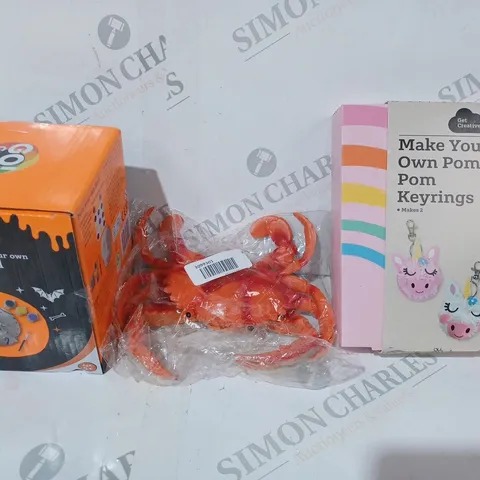 BOX OF APPROXIMATELY 20 ASSORTED TOYS AND GAMES TO INCLUDE MAKE YOUR OWN POM POM KEYRINGS, PAINT YOUR OWN SKULL, SQUEAKY CRAB, ETC