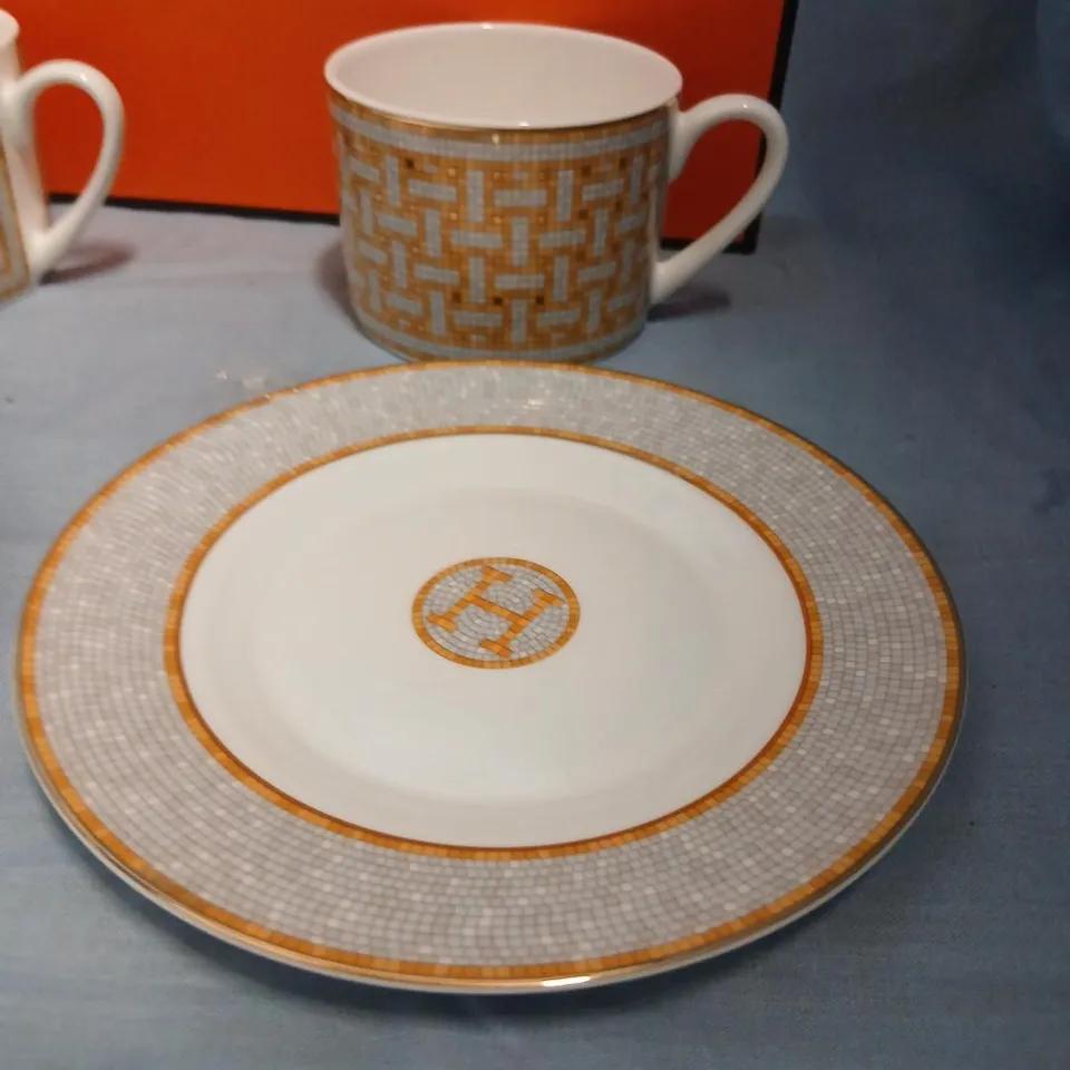 HERMÈS PARIS PORCELAIN SET – 2 MUGS & 2 PLATES WITH ORANGE LATTICE PATTERN