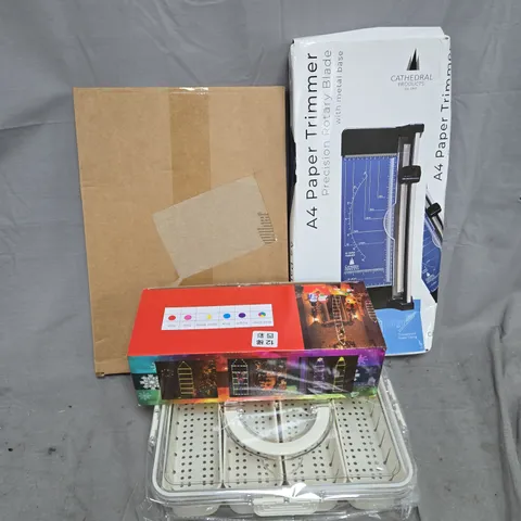 APPROXIMATELY 15 ASSORTED HOUSEHOLD PRODUCTS TO INCLUDE A4 PAPER TRIMMER, CHRISTMAS LIGHTS, GIFT WRAP, ETC