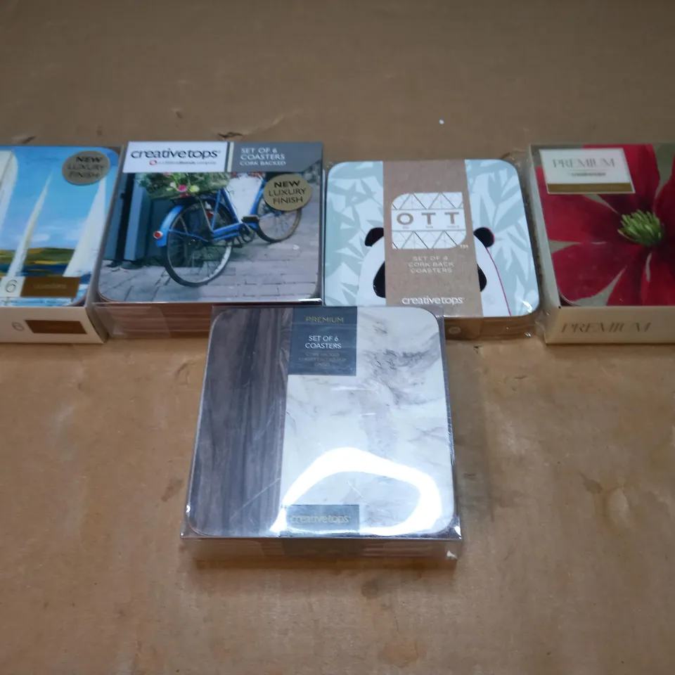 BOX OF APPROXIMATELY 15 PACKS OF CREATIVE TOPS CORK BACKED COASTERS IN ASSORTED DESIGNS 