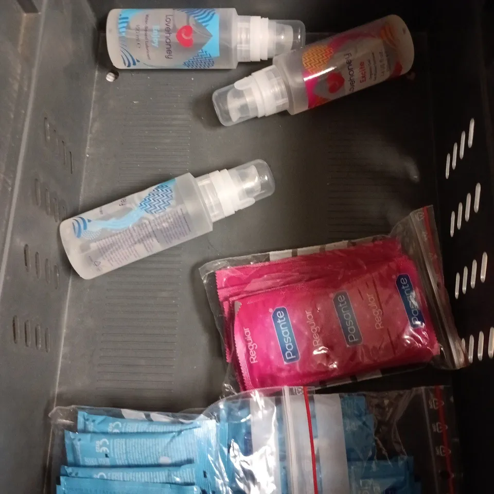 BOX OF APPROXIMATELY 10 PACKS OF ASSORTED CONDOMS AND LUBES TO INCLUDE DUREX, LOVE HONEY AND PASANTE