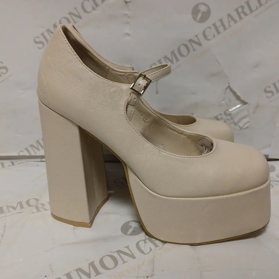 PAIR OF KOI DESIGNER VEGAN STRAP-UP PLATFORM HEELS IN CREAM - SIZE 6