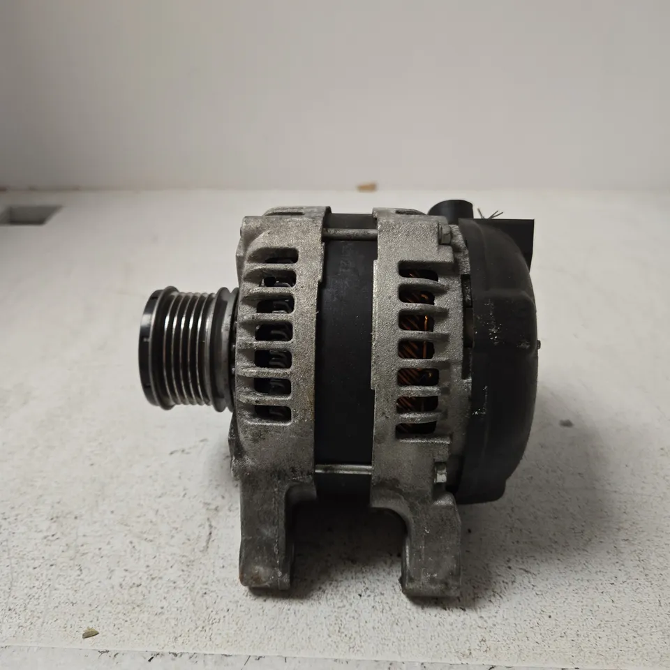USED AUTOMOTIVE ALTERNATOR WITH PULLEY AND MOUNTING BRACKET
