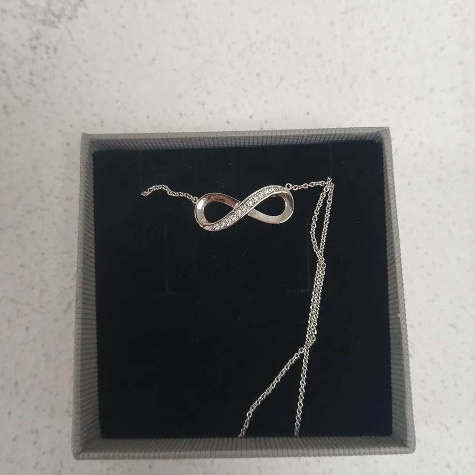 FIRETTI INFINITY NECKLACE – SILVER-TONE WITH CRYSTAL ACCENTS