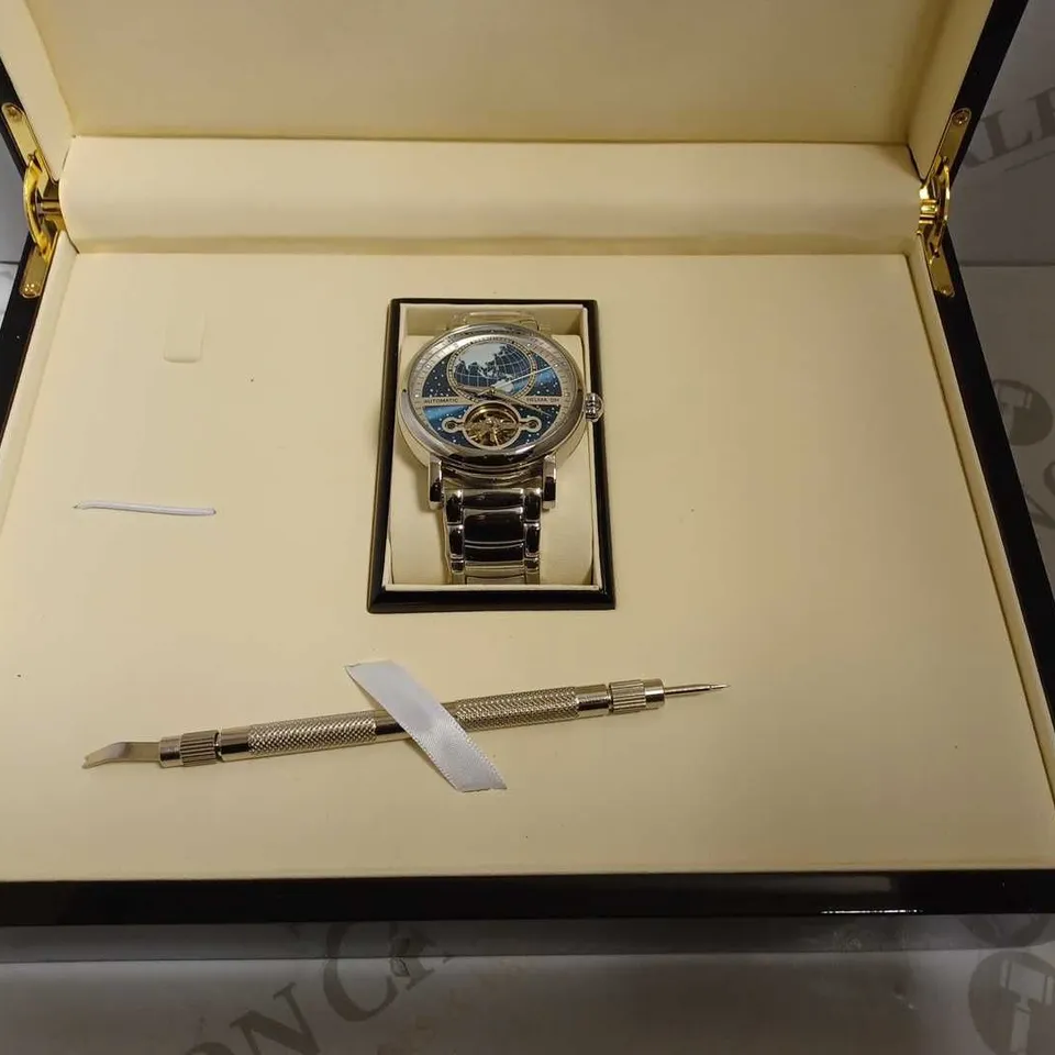 MEN’S HELMA DH AUTOMATIC WORLD VIEW WATCH – TOURBILLON MOVEMENT – BLUE DIAL – STAINLESS STEEL STRAP – GLASS EXHIBITION BACK CASE – LEATHER STRAP INCLUDED 