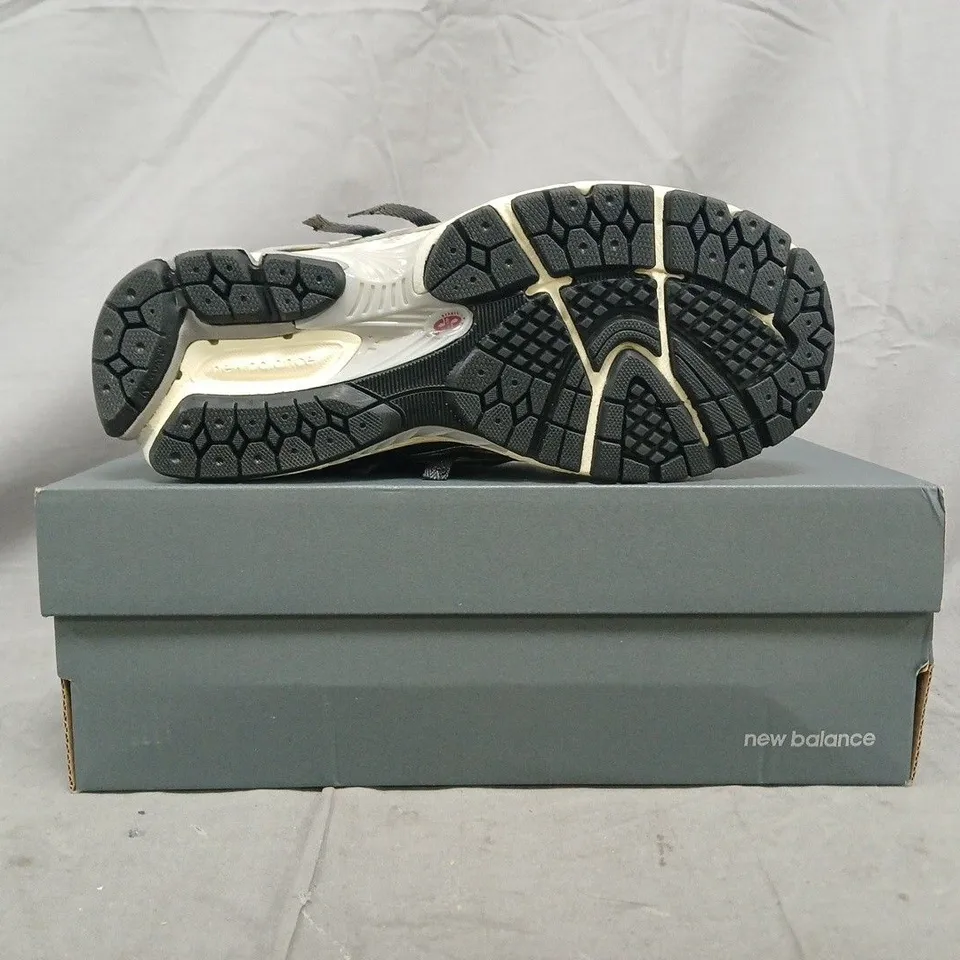 BOXED PAIR OF NEW BALANCE 1906A TRAINERS IN OFF WHITE/SILVER/BLACK SIZE UK 6