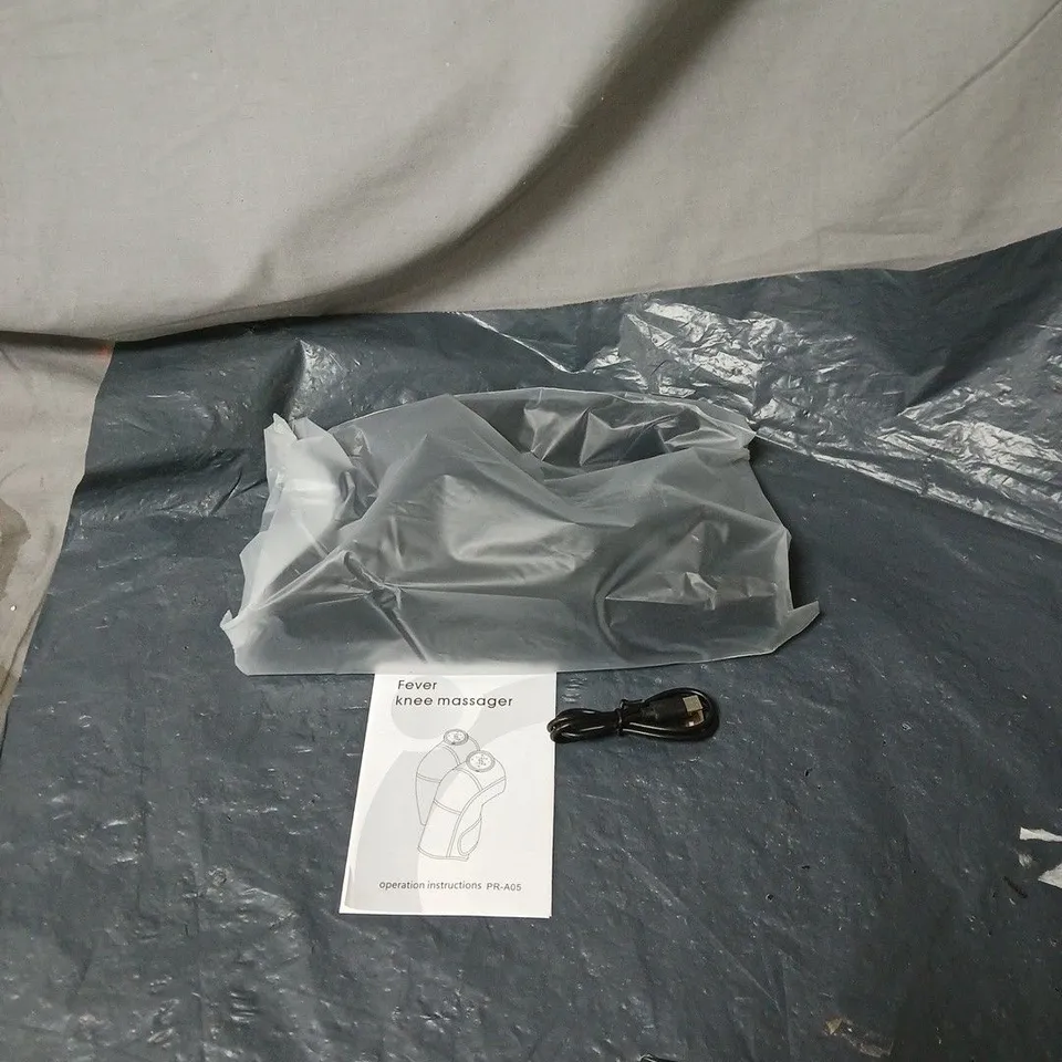 FEVER KNEE MASSAGER WITH MANUAL AND CABLE. BOXED