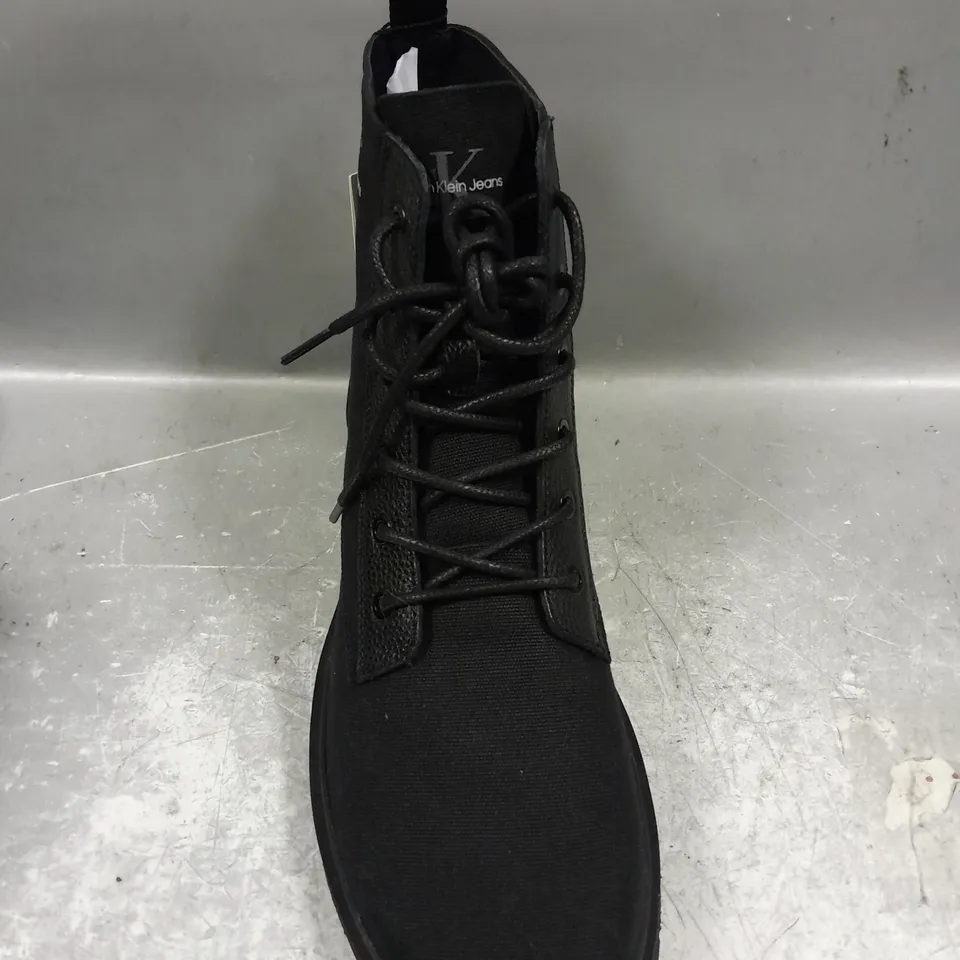 PAIR OF CALVIN KLEIN LACE UP BOOTS IN BLACK - 10.5