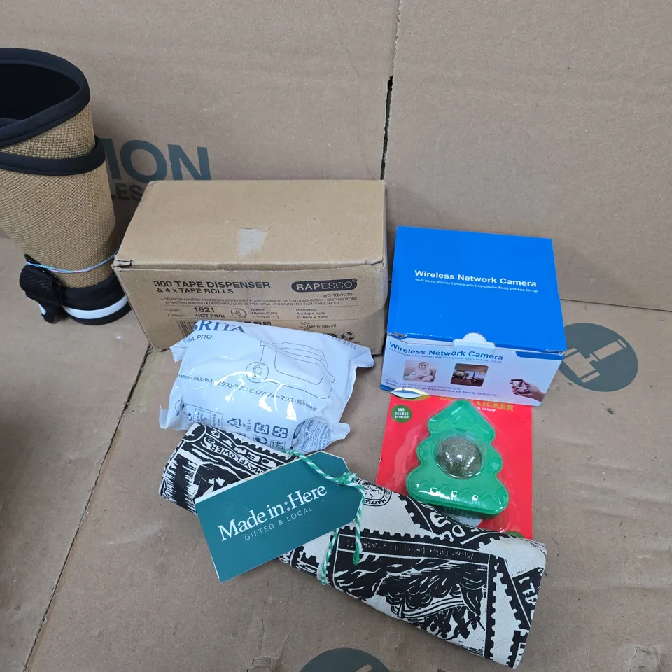 APPROXIMATELY 12 ASSORTED HOUSEHOLD ITEMS TO INCLUDE TAPE DISPENSER, WIRELESS NETWORK CAMERA, CATNIP LICKER, ETC