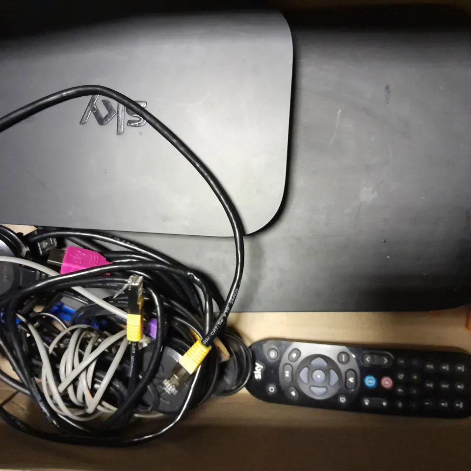 4 SKY ROUTERS AND BOXES WITH REMOTES AND CABLES