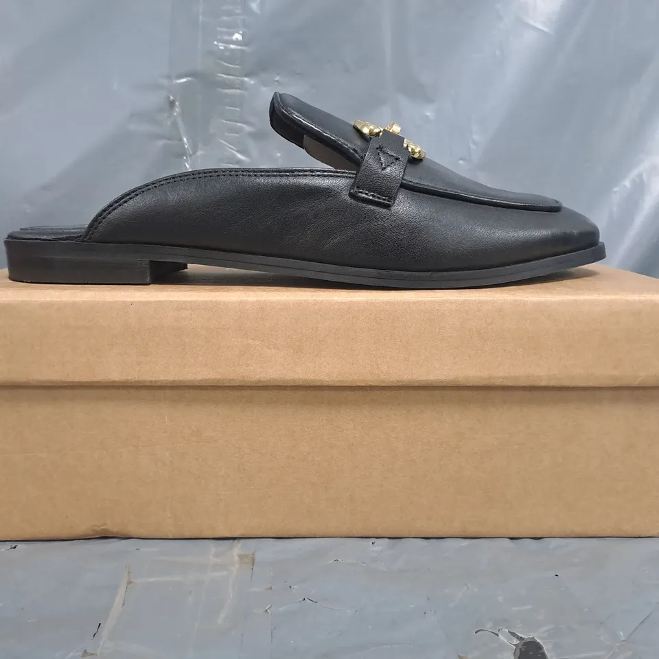 BOXED PAIR OF KAREN MILLEN OPEN BACK ELIP-ON LOAFERS IN BLACK W. GOLD EFFECT DETAIL SIZE 7