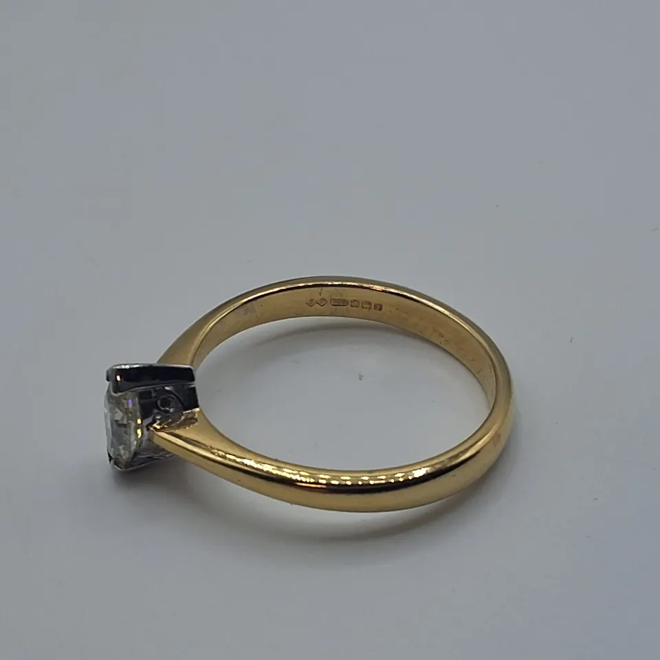 18CT GOLD SOLITAIRE RING SET WITH A NATURAL MARQUISE CUT DIAMOND