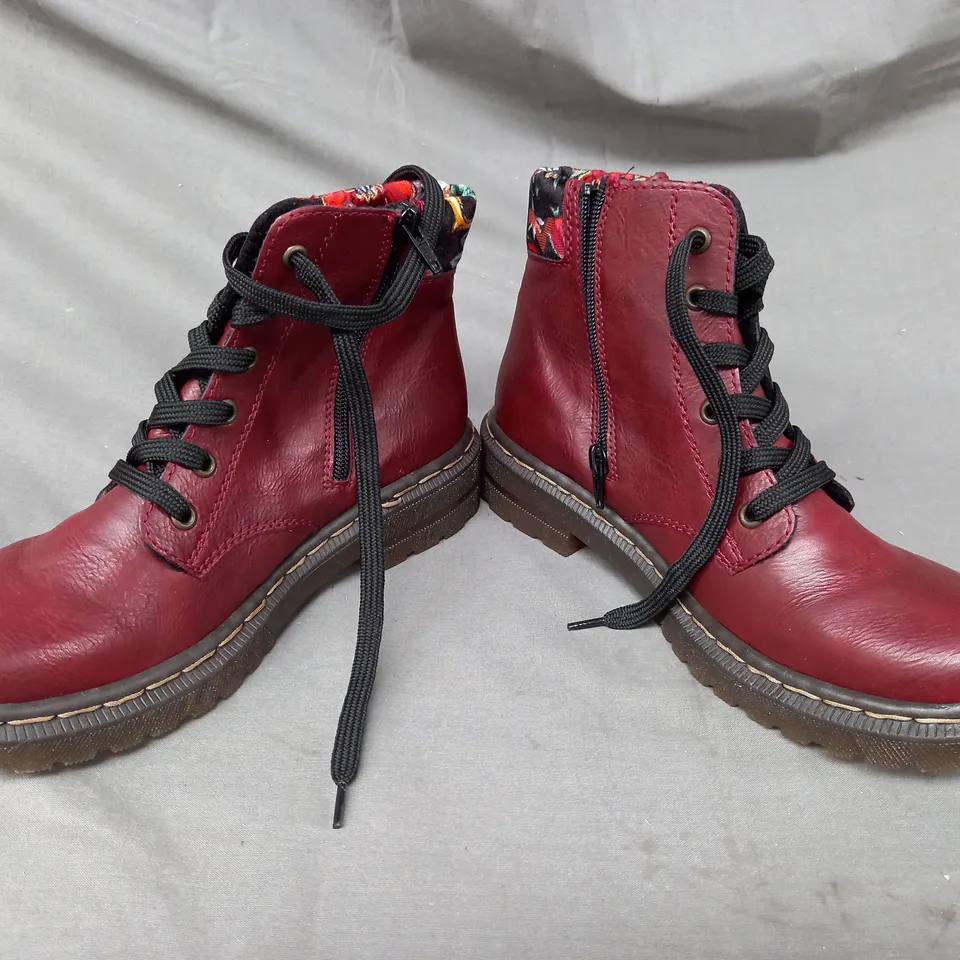 BOXED PAIR OF RIEKER BOOTS IN RED SIZE 6